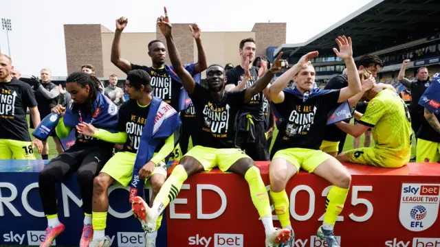 Port Vale celebrate promotion at Plough Lane on 26 April