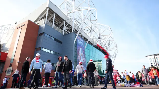 Fans gather outside Old Trafford