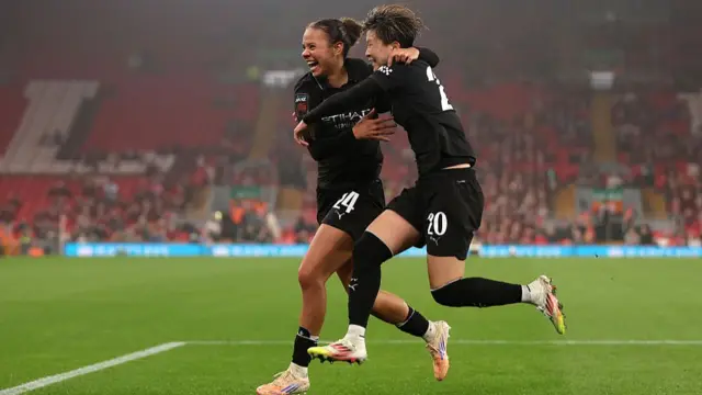 Beney and Fujino celebrate