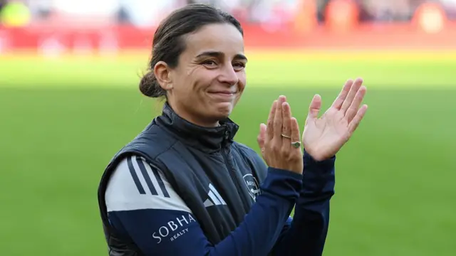 Renee Slegers, Manager of Arsenal, applauds the fans