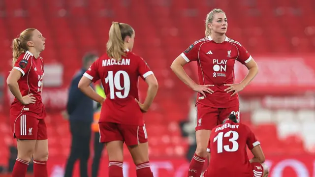 Liverpool players look dejected at the final whistle