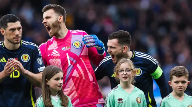 Scott McKenna, Angus Gunn and Andy Robertson during Scotland's national anthem