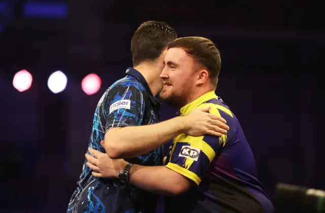 Luke Littler and Luke Humphries hug