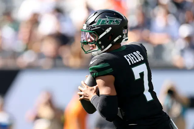 Justin Fields preparing to throw the ball