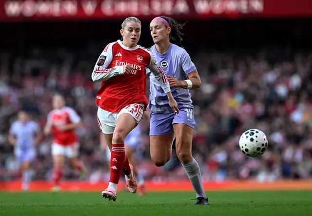 Alessia Russo of Arsenal breaks away from Caitlyn Hayes of Brighton
