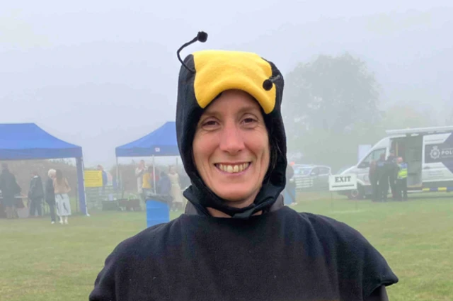 A woman in a bee costume