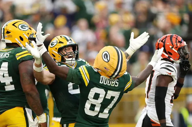 Tucker Kraft and Romeo Doubs celebrate