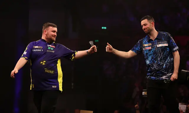 Luke Humphries and Luke Littler bump fists