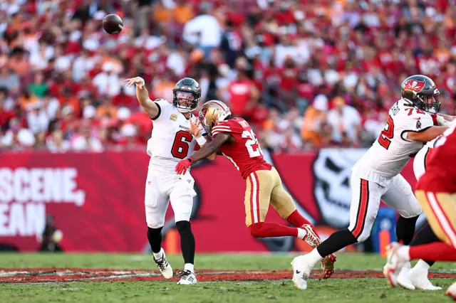 Baker Mayfield fires a pass