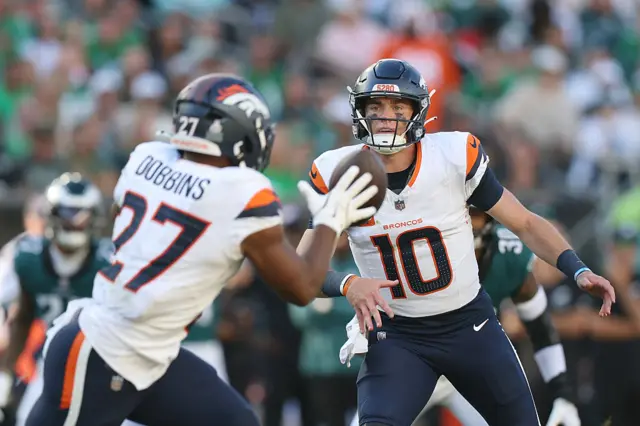 Bo Nix throws the ball to JK Dobbins for the Denver Broncos
