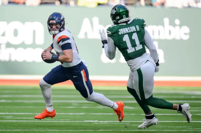 Denver Broncos quarterback Bo Nix runs the ball against the New York Jets