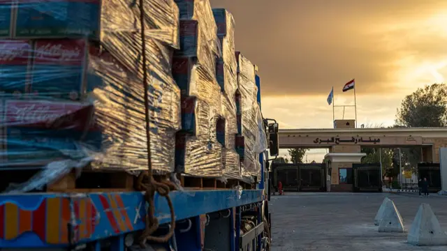 Truck carrying aid enter Gaza through the border crossing on October 12, 2025 in Rafah, Egypt.