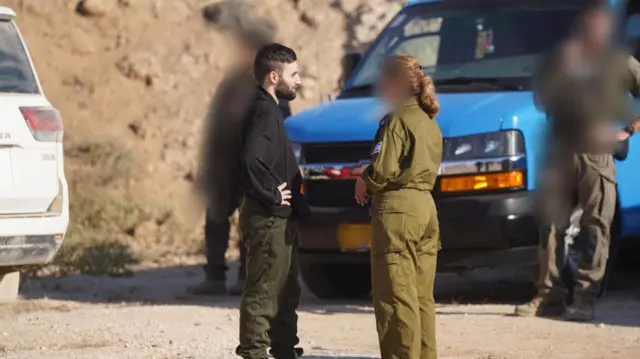 Released hostage Matan Angrest  is seen meeting with an IDF officer in the Gaza Strip shortly after being freed from Hamas captivity.