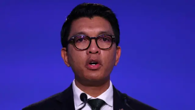 Andry Rajoelina talks into a microphone