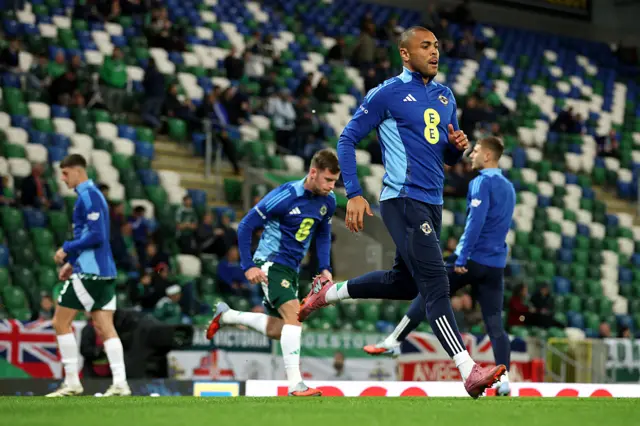 Josh Magennis of Northern Ireland warms up prior to the FIFA World Cup 2026 qualifier match between Northern Ireland and Germany