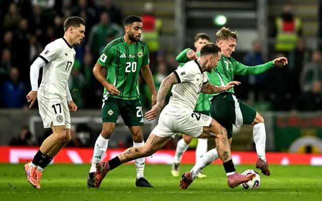 Ethan Galbraith of Northern Ireland in action against David Raum of Germany during the FIFA World Cup 2026 qualifier match between Northern Ireland and Germany