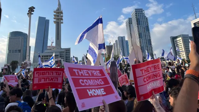 Signs saying "They're coming home"