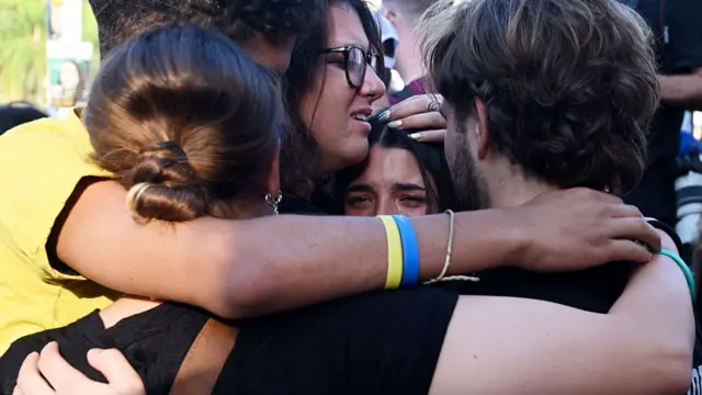People hug and celebrate as they celebrate in Hostages Square