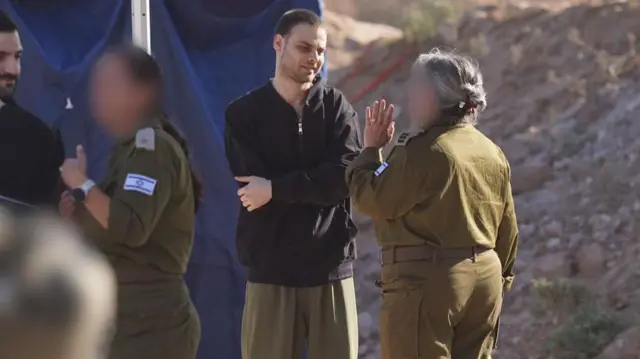 Photos show released hostage Alon Ohel meeting with Israeli forces in the Gaza Strip after being freed from Hamas captivity