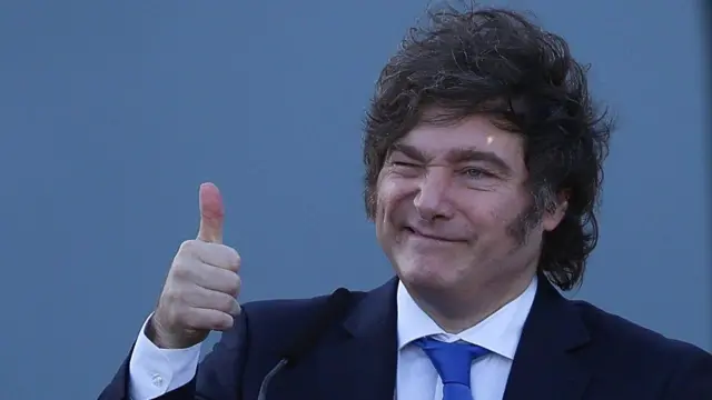 Argentine President Javier Milei gestures with a thumbs up