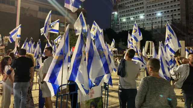 People gather with Israeli flags in Hostages Square
