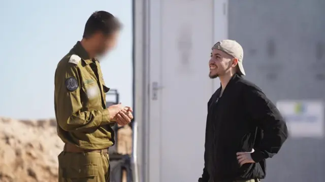 Released hostage Eitan Mor  is seen meeting with an IDF officer in the Gaza Strip shortly after being freed from Hamas captivity.