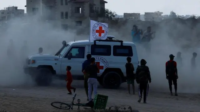A red cross vehicle travelling through the Gaza Strip