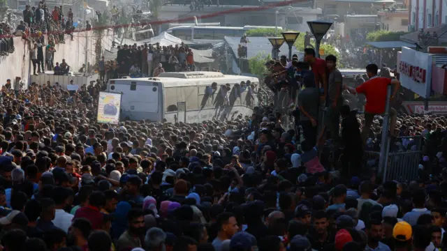 People gather at Nasser hospital as they welcome freed Palestinian prisoners released by Israel