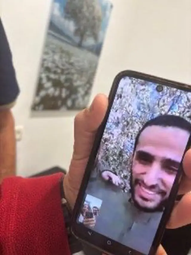 Video call on phone with man on the screen