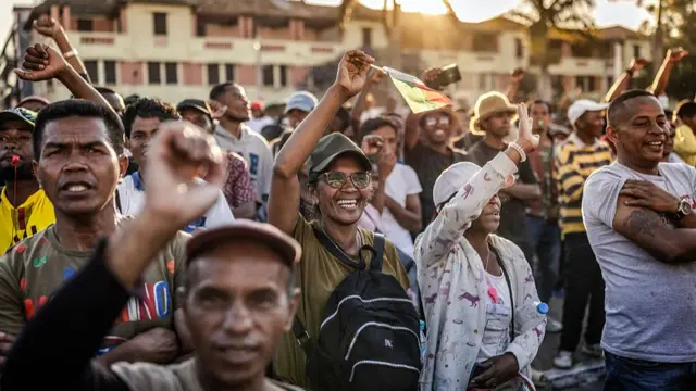Protesters are pictured raising their fists