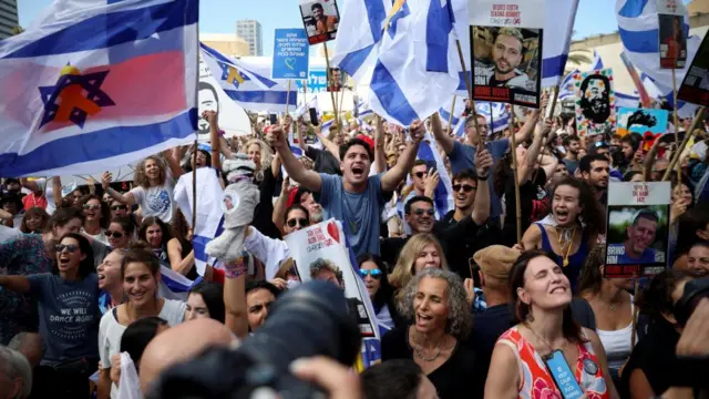 People react at "Hostages Square" on the day Hamas releases hostages