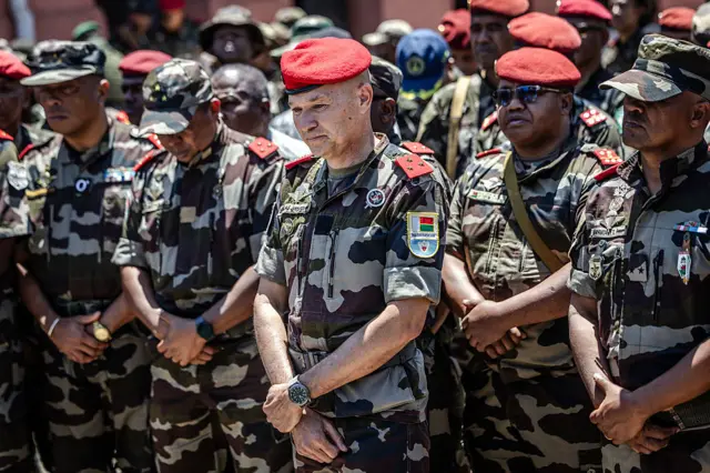General Demosthene Pikulas (C), declared new head of the Malagasy Army by members of Madagascar's CAPSAT unit, attends a ceremony in honour of a soldier killed during clashes the previous day at their base in Antananarivo, on October 12, 2025
