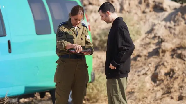 Released hostage Guy Gilboa-Dala is seen meeting with an IDF officer in the Gaza Strip shortly after being freed from Hamas captivity.