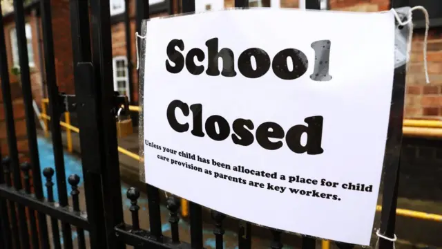 Signage which says "school closed" outside a closed West Bridgford Infants School in Nottingham