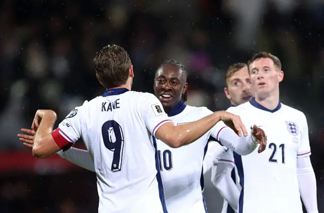 Eze celebrates with Kane