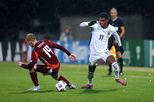 Marcus Rashford of England runs with the ball