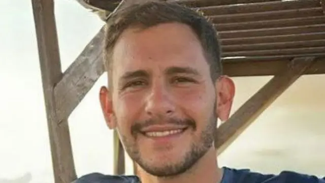 A picture Daniel Peretz smiling to camera
