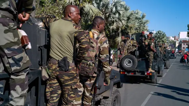 Members of the military ride transport vehicles in Antananarivo, Madagascar, 14 October 2025