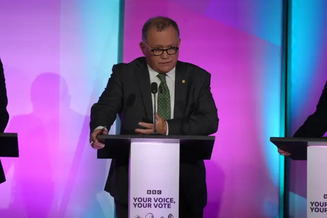 A man stood at a podium