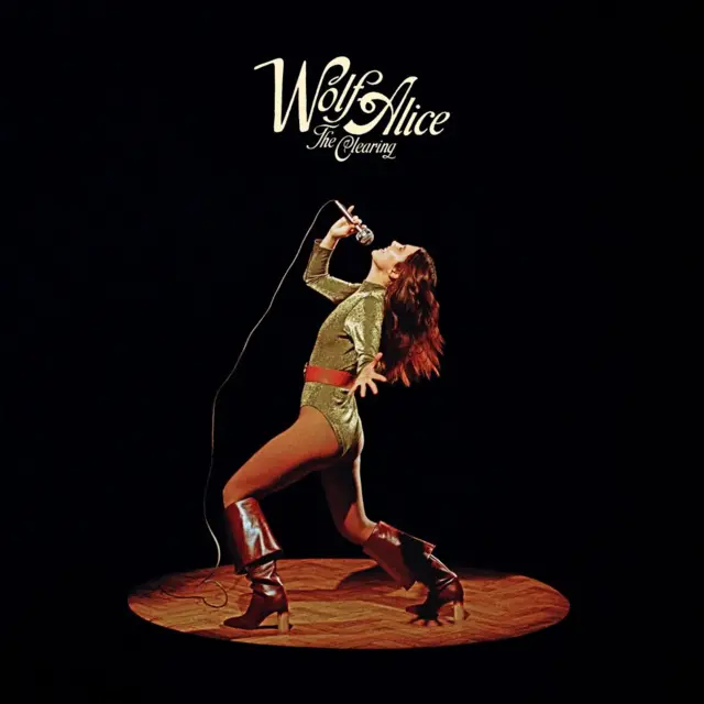 Wolf Alice's cover art, with its singer under a splotlight, lunging while singing into a microphone