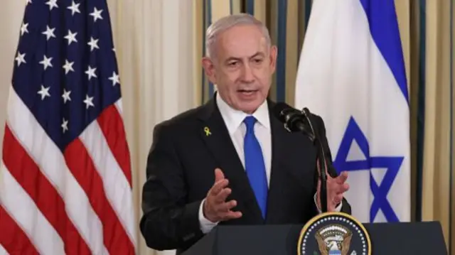Israeli Prime Minister Benjamin Netanyahu delivers remarks during a joint news conference with U.S. President Donald Trump