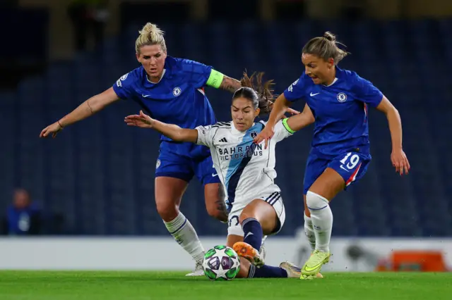 Paris FC's Clara Mateo in action with Chelsea's Millie Bright and Johanna Rytting Kaneryd