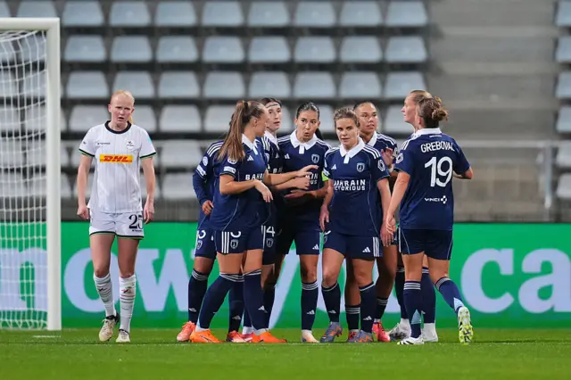 Paris FC players huddle after conceding