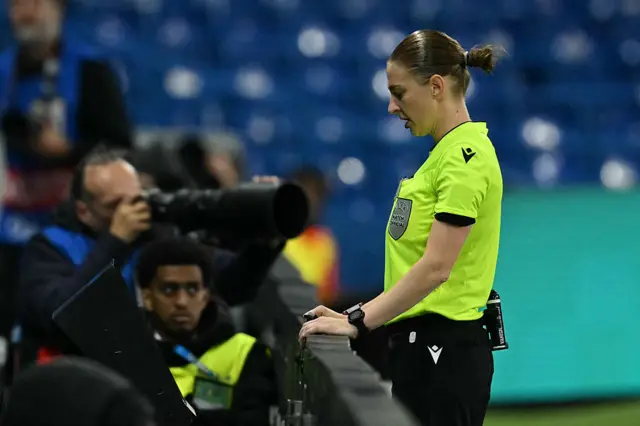 Referee Michalina Diakow looks a the VAR replay before awarding Chelsea a penalty
