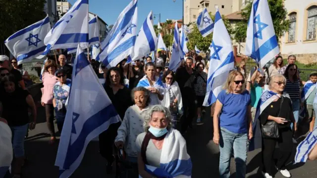 People escort the coffin of late Israeli hostage Guy Illouz during his funeral procession in Rishon LeZion, Israel, 15 October 2025.