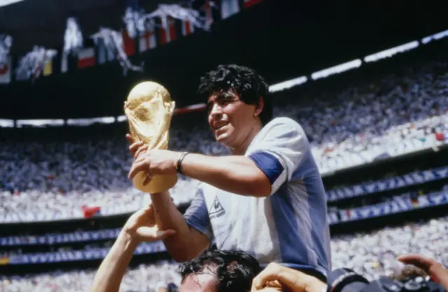 Maradona with the World Cup trophy in 1986