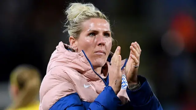 Bright applauds the England fans after their defeat to Belgium last year