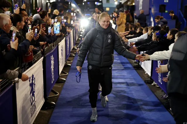 Sjoeke Nuesken of Chelsea interacts with the fans as she arrives.