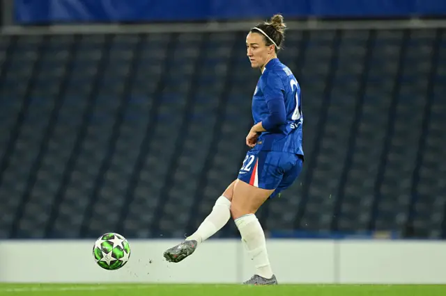 Lucy Bronze plays the ball.