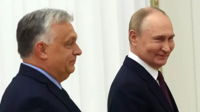 Russian President Vladimir Putin (R) and Hungarian Prime Minister Viktor Orban (L) smile while leaving their joint press conference at the Senat Palace of the Moscow's Kremlin on July 5, 2024 in Moscow
